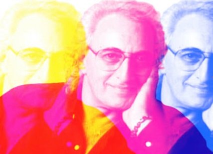 Paula Kent in black in white in front of original redken products.